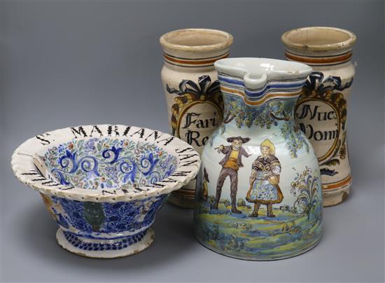 A pair of majolica albarelli, a faience jug and a footed bowl, tallest 27c,